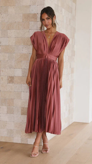 Long dress with deep V-neck and bow on the back