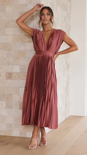 Long dress with deep V-neck and bow on the back